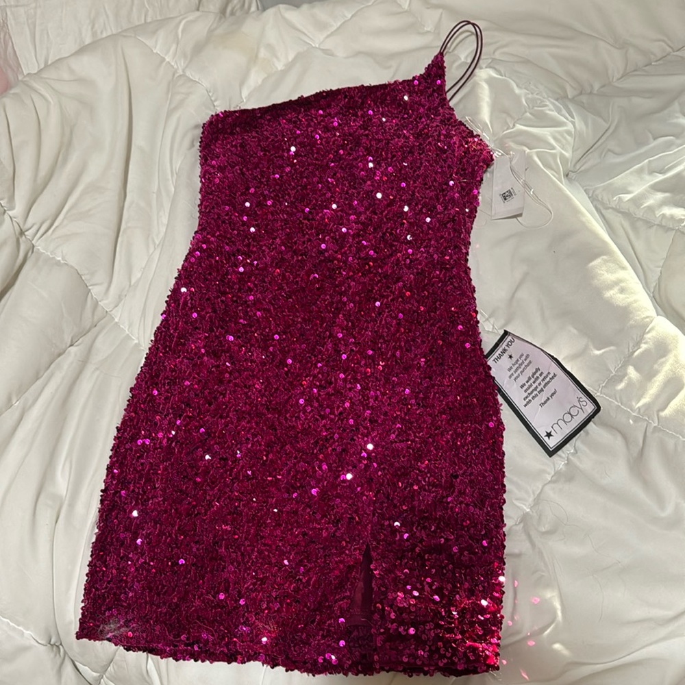 A hot pink-purple dress. Never worn before. Sparkly and size Medium